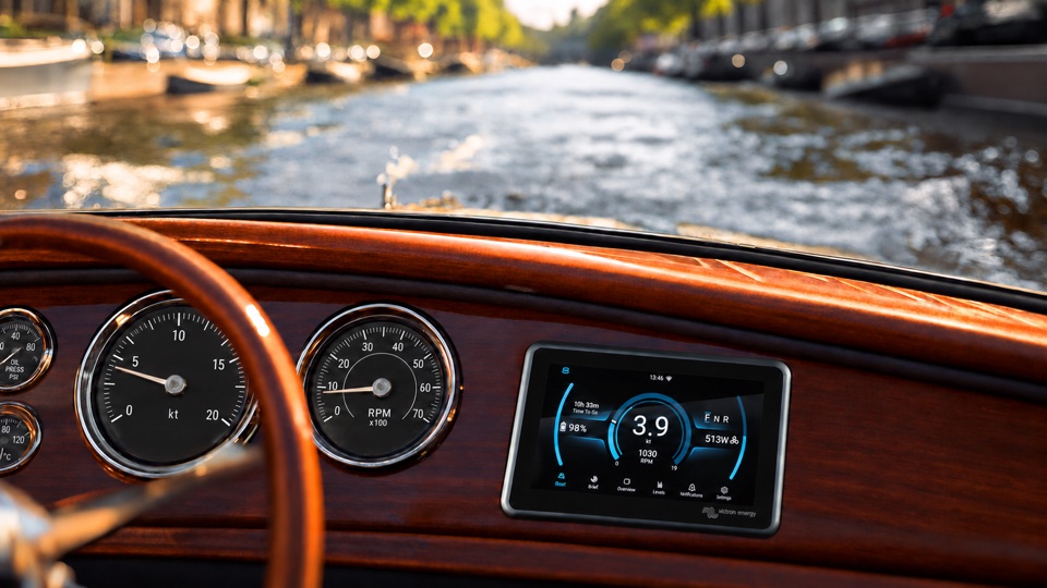 E-Drive display mounted in a classic wooden boat dashboard